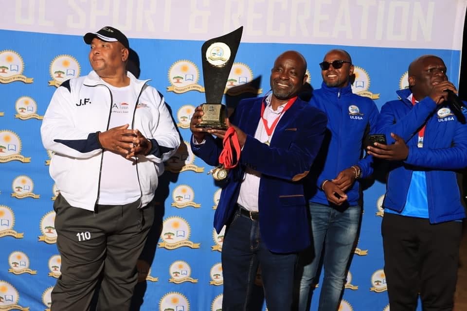 Joe Mahomole holding the ULSSA Team Champions trophy in 2023